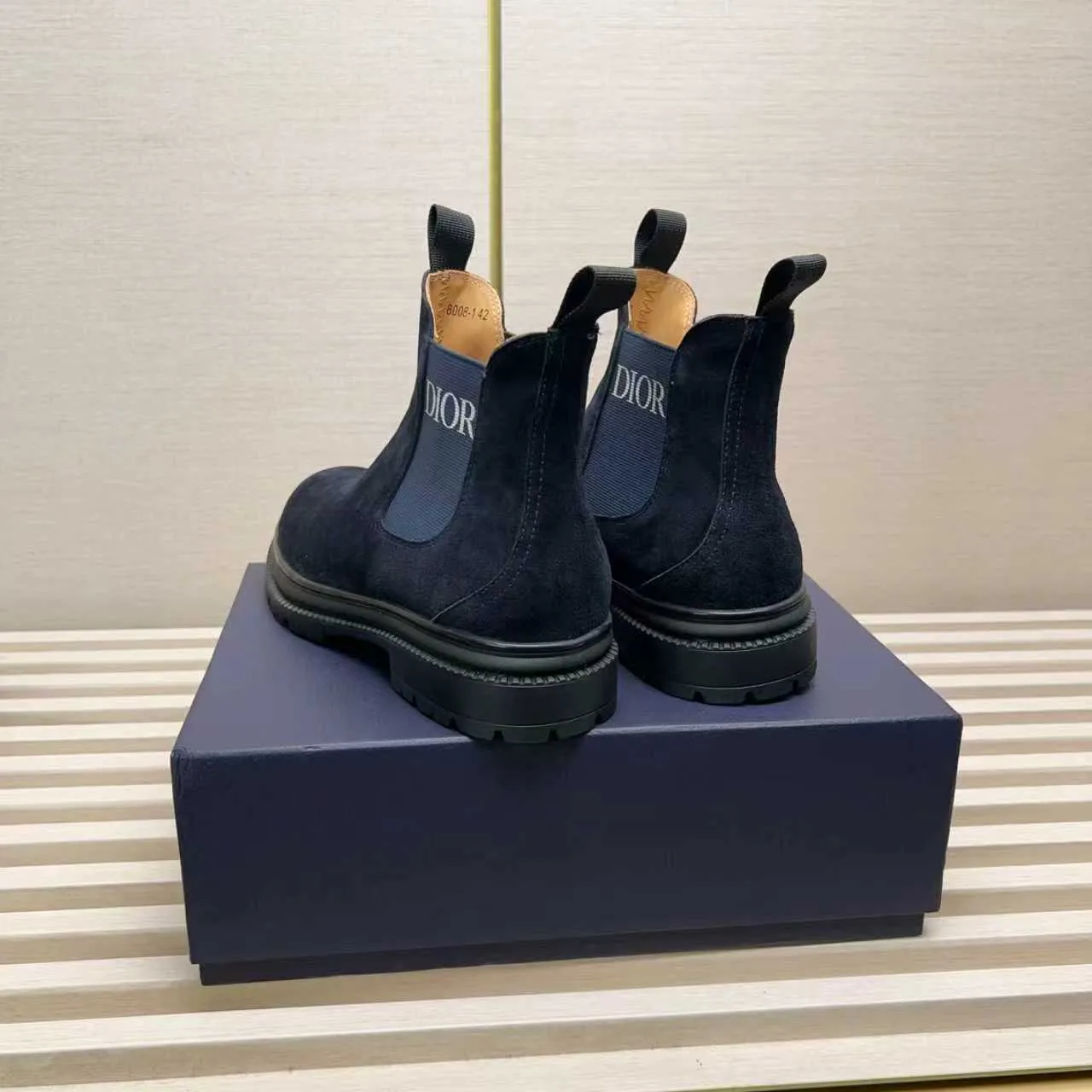 Men's Shoes 💰480 Dior A practical choice that combines protection with classic style. Made from durable Rugged Calf leather, it's tumbled and hand-finished to create a soft suede feel with a rich texture. Elastic side panels and subtle cutouts are inspired by the classic Chelsea boot. Leather upper and lining with Kummel tabs at front and rear, rubber outsole